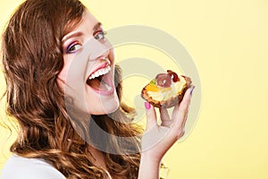 Closeup woman eating fruit cake sweet food