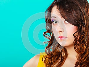 Closeup woman face long curly hair portrait