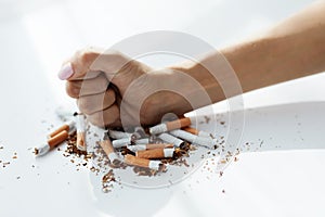 Closeup Of Woman Hand Breaking Cigarettes. Quit Bad Habit