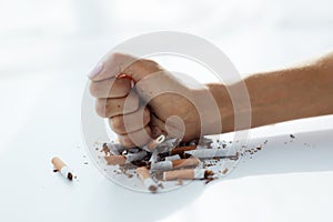 Closeup Of Woman Hand Breaking Cigarettes. Quit Bad Habit