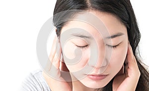 Closeup woman hand closes her ears with white background.