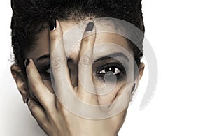 Closeup of woman with hand on her face