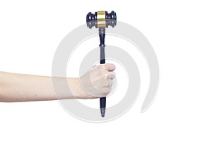Closeup of woman hand holding gavel isolated on white background. Concept of fairness, honesty, integrity, impartiality photo