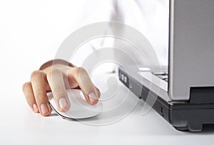 Closeup woman hand on mouse