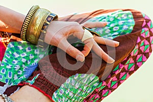 Close up of woman hand in mudra gesture practice yoga meditation outdoor by the lake summer day