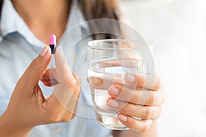 Closeup woman hand with pills medicine tablets