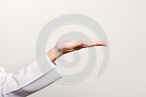 Closeup of woman hand pointing on white background