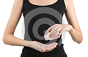 Closeup woman hand pouring white pills into her hand. photo