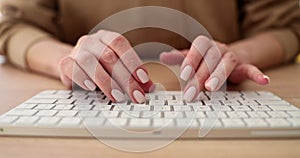 Closeup of woman hand and typing on keyboard
