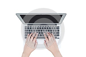 Closeup woman hand typing on keyboard at the gray notebook computer isolated on white background photo