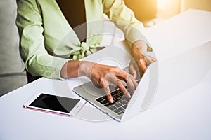 Closeup of woman hand working at home office and typing on keyboard. Business and technology theme. People lifestyles and Office