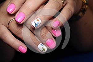 Closeup of woman hands with nail design.