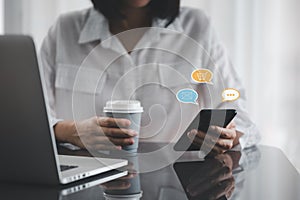 Closeup woman hands using smart phone with message icon as chatting