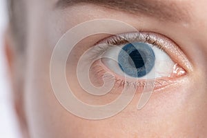 Closeup of a woman has an electronic eye