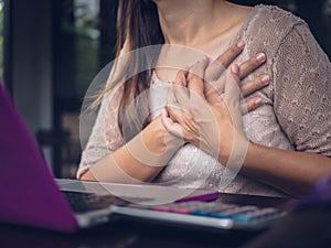 Closeup woman having heart attack.