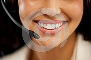 Closeup, woman and headphone for working in call center or customer care in office with smile and positivity. Female