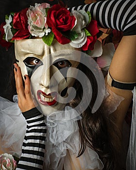 Closeup of Woman in a Jester Like Pierrot Mask