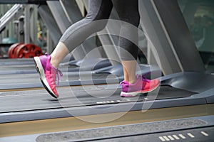 closeup on woman leg running on treadmill after her work