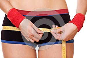 Closeup woman measuring hips 90 centimeters photo