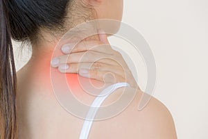 Closeup woman neck and shoulder pain and injury.