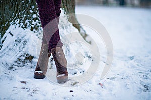 Closeup on woman outdoors in city park in winter