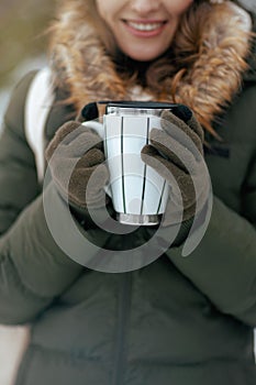 Closeup on woman outdoors in city park in winter