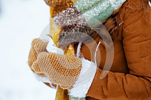 Closeup on woman outdoors in city park in winter