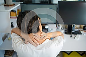 Woman with pain in her neck and shoulder and injury. Health care and medical concept.