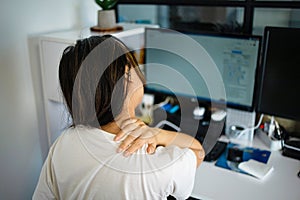 Woman with pain in her neck and shoulder and injury. Health care and medical concept.