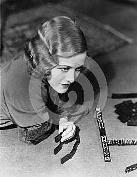 Closeup of woman playing dominos