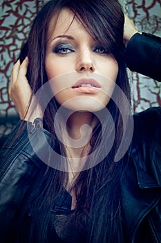 Closeup woman portrait over cracked wall