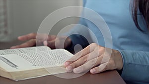 Closeup woman relax sitting reading book in the living room at home