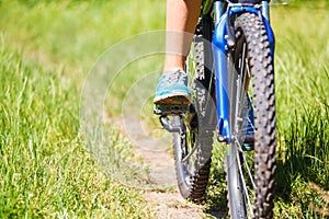 Closeup woman riding mountain bike