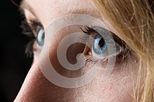 Closeup of a woman's blue eyes