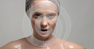 Closeup of woman`s face with wet skin