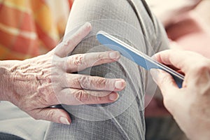 Closeup of woman's hand with nailfile photo