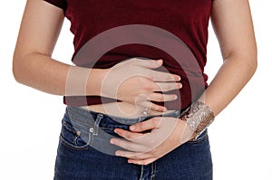 Closeup of a woman`s stomach with pain