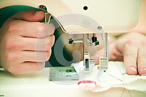 Closeup Of Woman At Sewing Machine