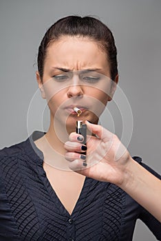 Closeup of woman smoking cigarette and a hand with