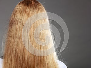 Closeup of woman with static blonde hair.