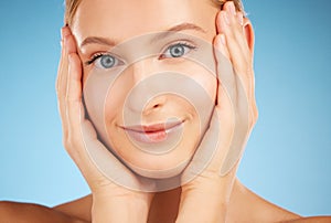 Closeup woman, studio portrait and skincare beauty, natural skin glow and clean aesthetic by blue background. Healthy