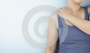 Closeup woman suffering from neck and shoulder pain. Health care and medical concept