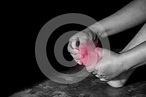 Closeup woman suffering from pain in toe