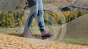 Closeup of Woman Traveler Hiking in the Mountains