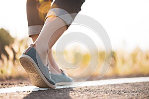 Closeup woman walking towards on the road side. Step concept