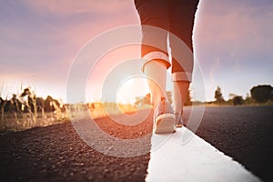 Closeup woman walking towards on the road side. Step concept