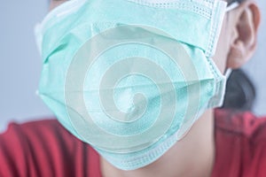 Closeup woman wearing hygiene protective mask to protect COVID19 virus face mask to protect corona virus crisis face of a woman