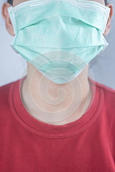 Closeup woman wearing hygiene protective mask to protect COVID19 virus face mask to protect corona virus crisis face of a woman