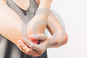 Closeup women elbow pain/injury with red highlights on pain area
