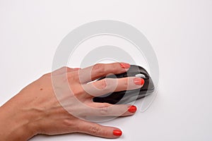 Closeup of a women hand using modern computer mouse on white su